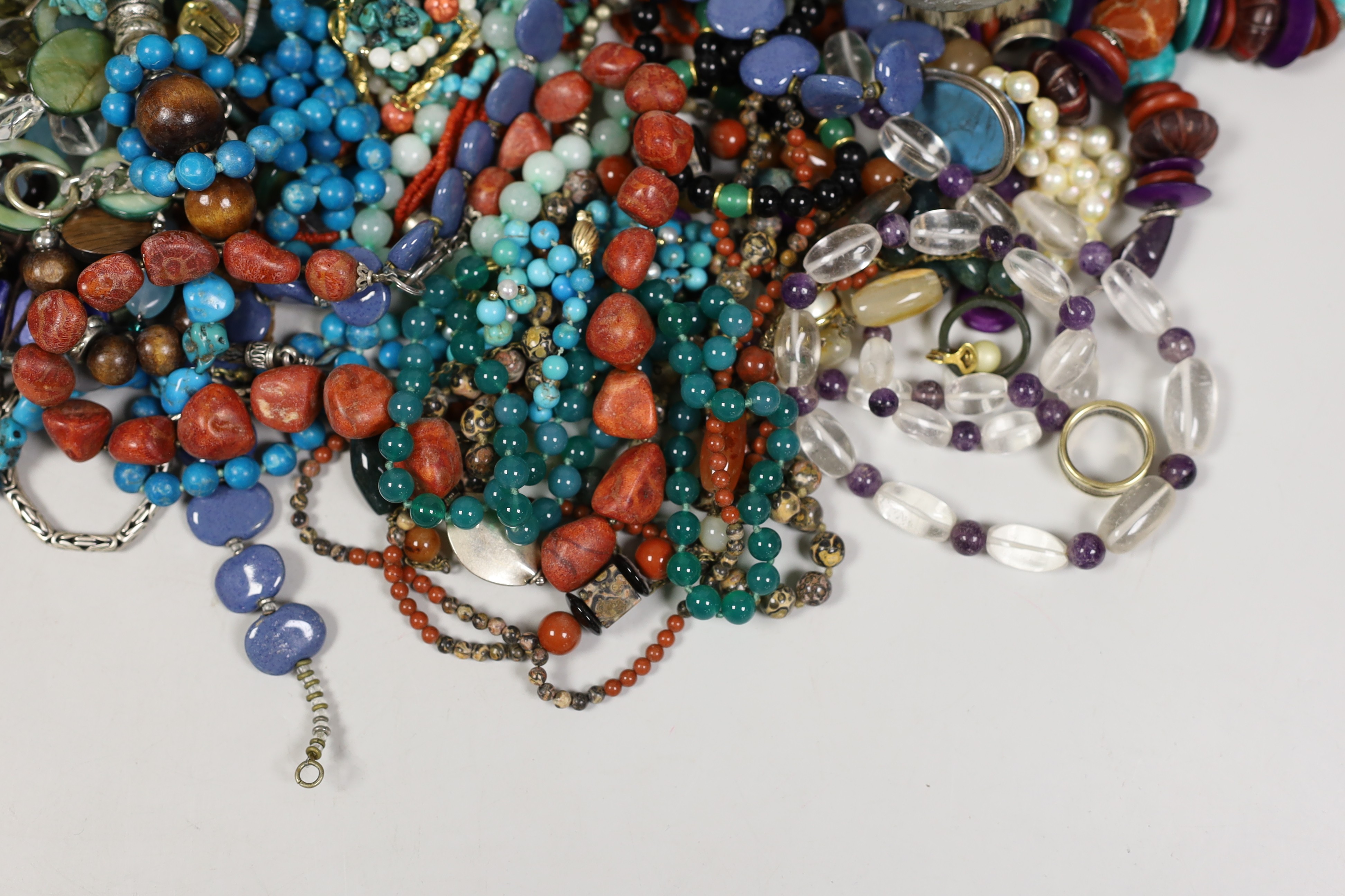 A quantity of assorted costume jewellery, including white metal and moonstone bracelet and other items including a small silver plated Dunhill lighter.